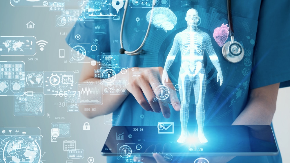 doctor with a projection of the human body from an ipad screen